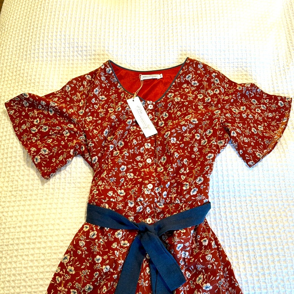 Orange with blue flower detail midi dress.